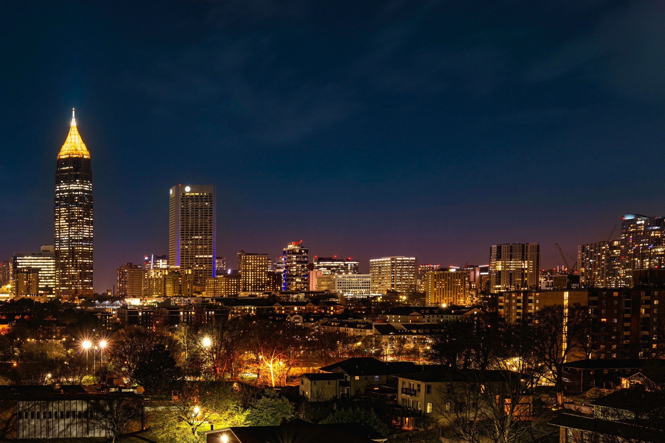 City skyline at night representing discreet field operations