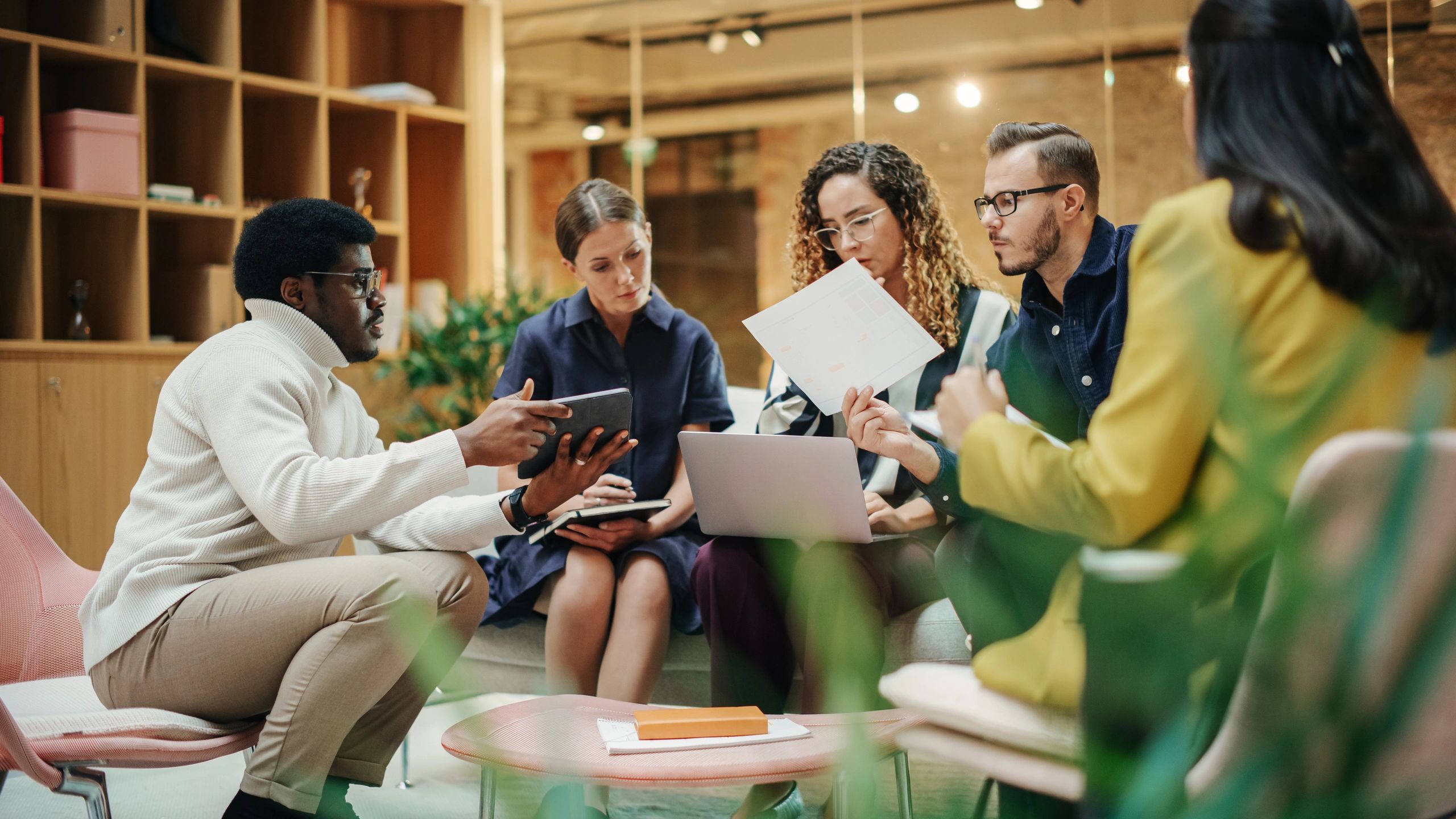 Security planning meeting with a multiethnic team in a conference room