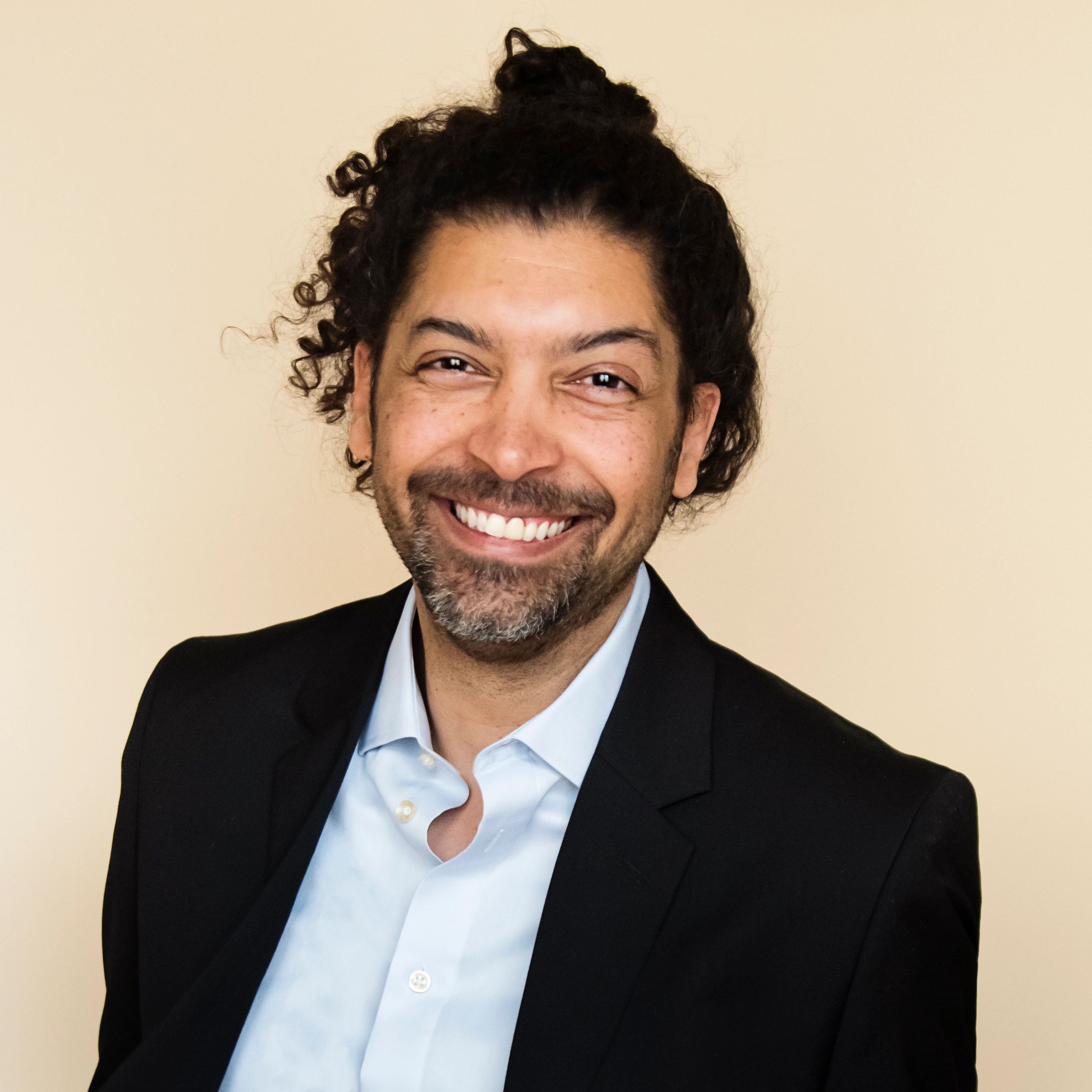 Professional headshot representing investigations leadership